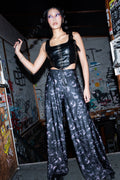 BlackMilk Horror Bound Palazzo Pants – grey trapped-souls print high-waisted wide-leg Halloween palazzo pants, part of the BlackMilk Clothing Halloween collection