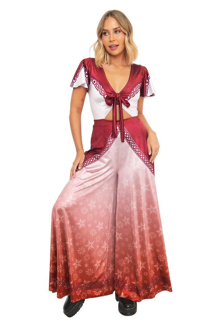 Close-up front view of the BlackMilk Lord of the Rings I Am No Man Rio Jumpsuit, showing the tie-front crop top and Celtic knot border print in burgundy red.