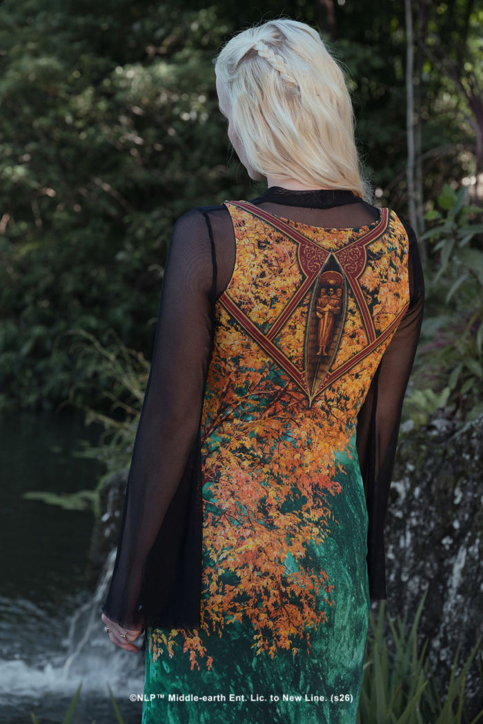 Close-up campaign shot of the I Would Have Followed You Column Maxi Dress by BlackMilk, showing the Boromir funeral boat emblem and golden leaf print.