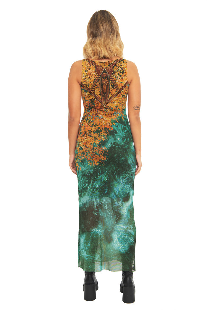 Back view of the BlackMilk I Would Have Followed You Column Maxi Dress, showing the golden autumn leaf and teal water print flowing down the bodycon column silhouette.
