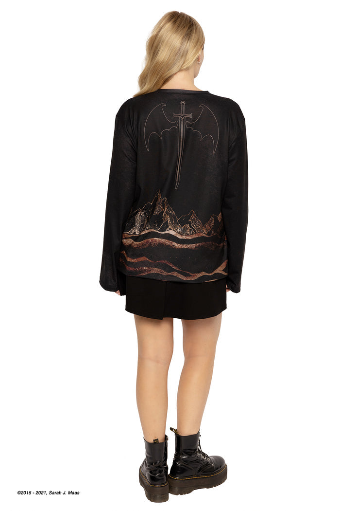 ACOTAR series Illyrian skies boyfriend tee, inspired by A Court of Thorns and Roses books by Sarah J Maas, featuring gold linework city design, winged figures and oversized unisex silhouette, Night Court aesthetic