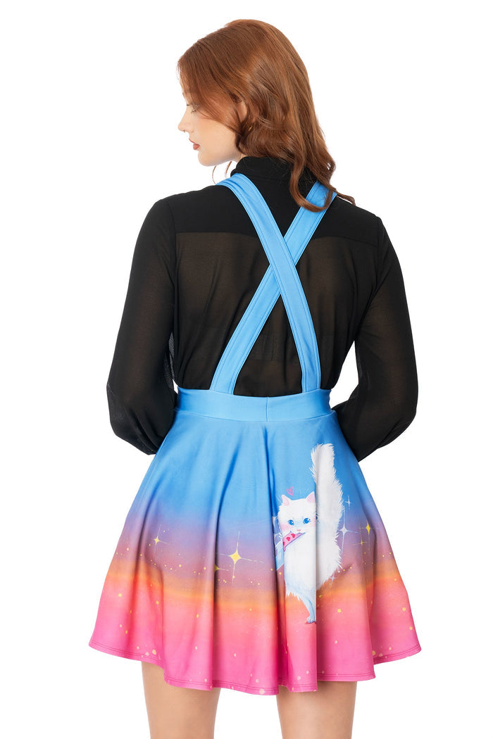 Model wearing pink apron dress with Lora Zombie cat artwork and adjustable straps - wearable art by BlackMilk