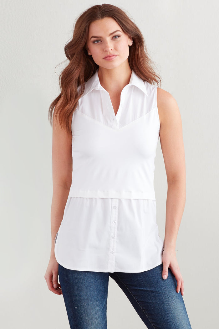A fashion model wearing the Finley layering tank, a chambray sleeveless button-down blouse with a shirt tail hem and a knit bodice.