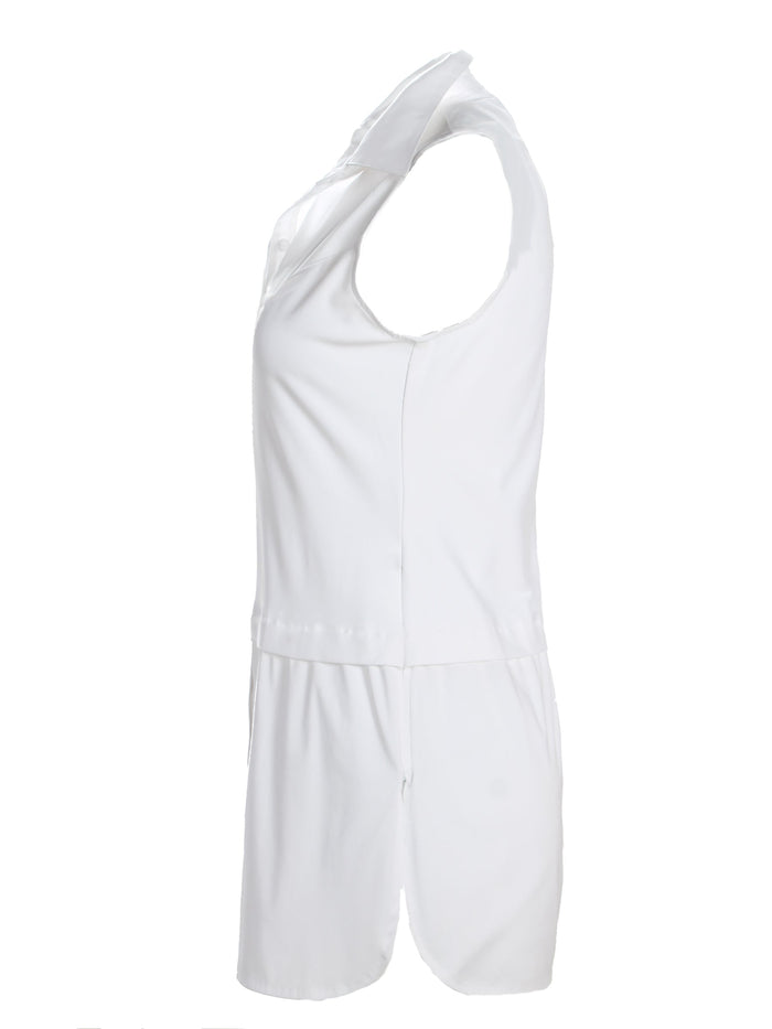 A back view of the Finley layering tank, a chambray sleeveless button-down blouse with a shirt tail hem and a knit bodice.