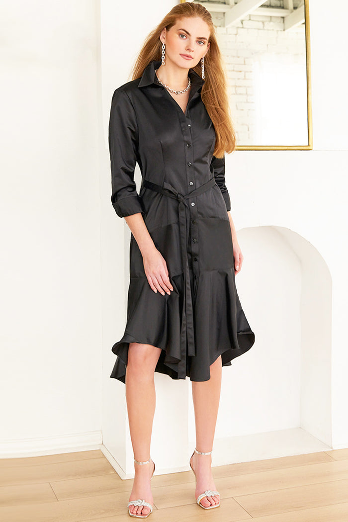 Woman wearing Leonardo, a black Finley dress with a front tie in micro satin