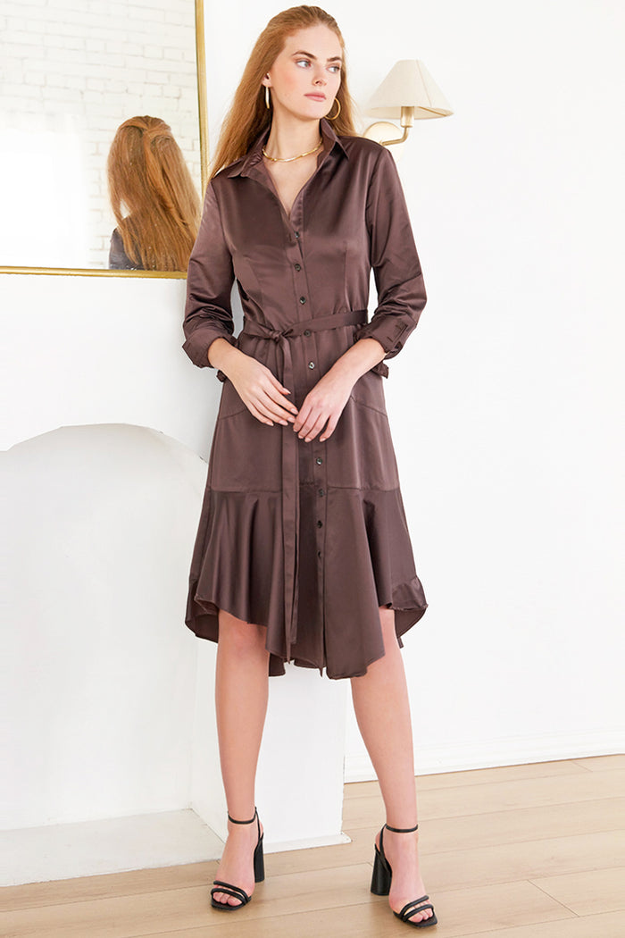 Woman wearing Leonardo, a brown Finley dress with a tie front in micro satin chocolate