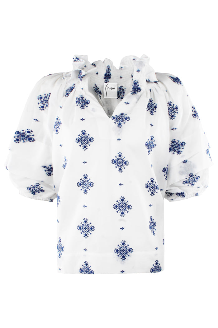 White blouse with blue floral patterns on a white background