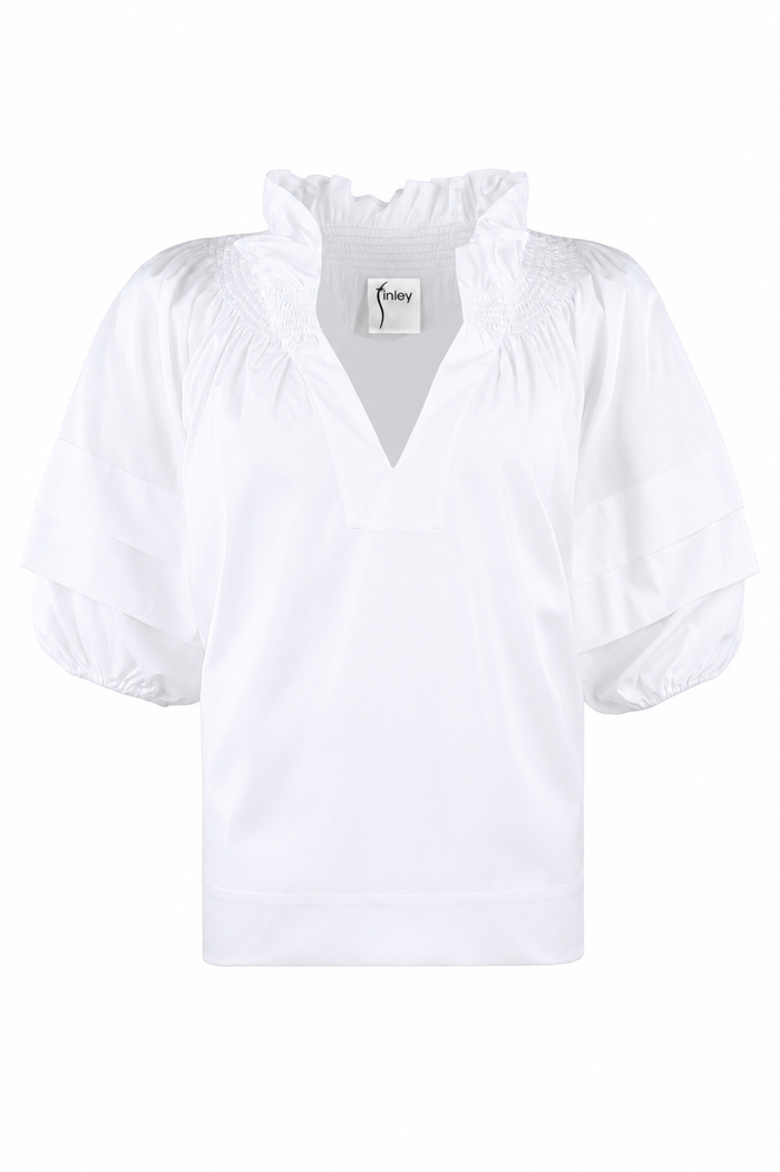 White blouse with a brand label on a white background