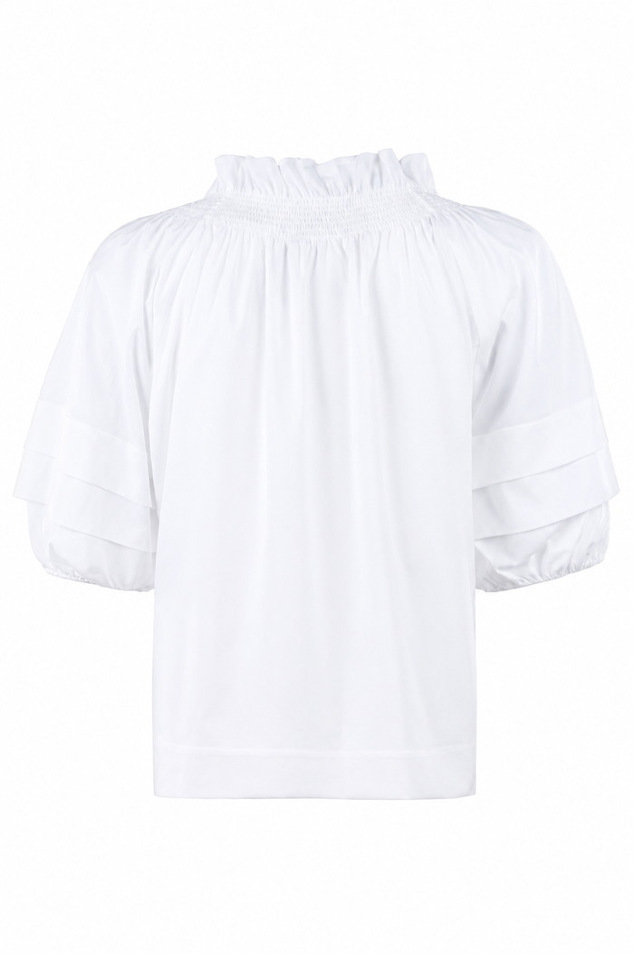 White blouse with ruffled details on a white background