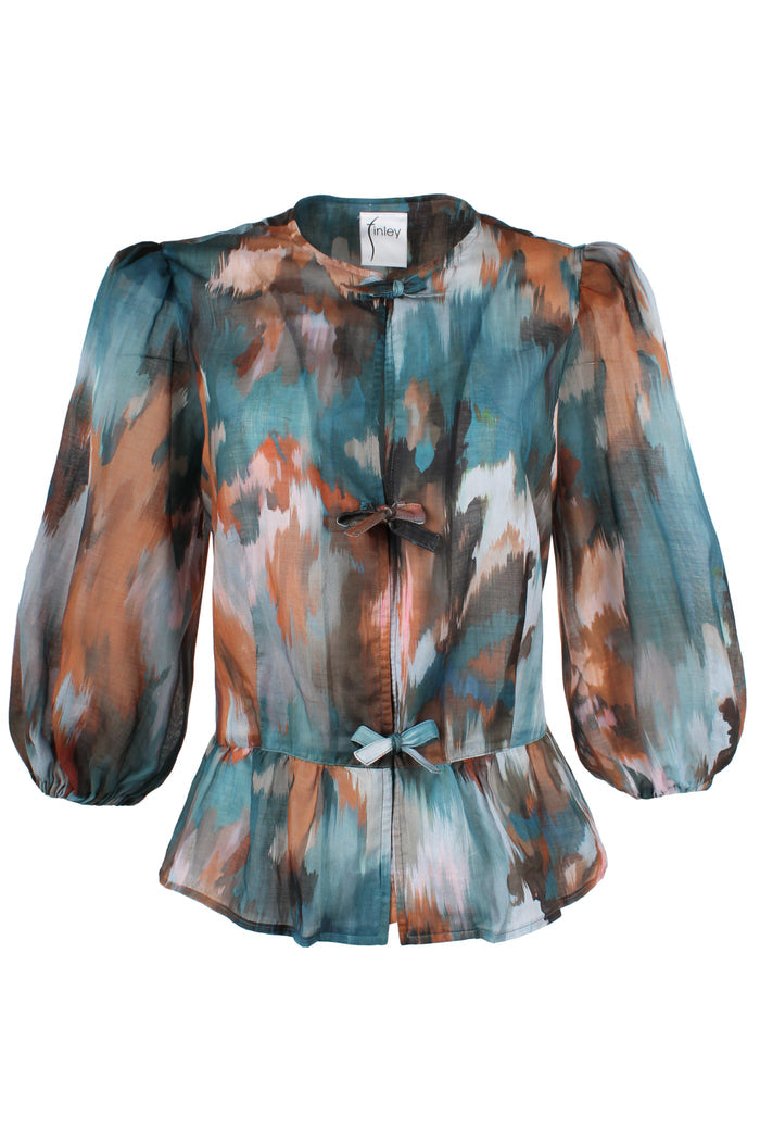 Front view of the Finley Luna blouse, a peplum hem tie front puff sleeve blouse in green floral pattern.