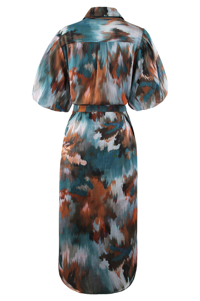 Rear view of the Finley Madeline dress, a green floral cotton voile maxi shirt dress with puff sleeves and an autumn pattern.