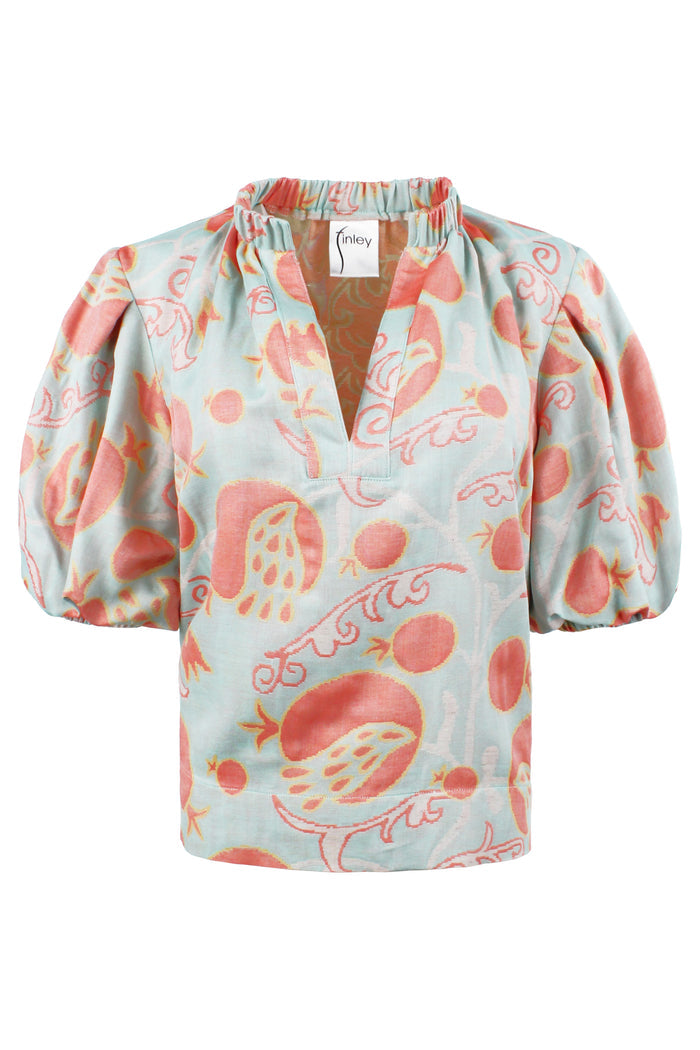 Floral patterned blouse with puff sleeves on a white background