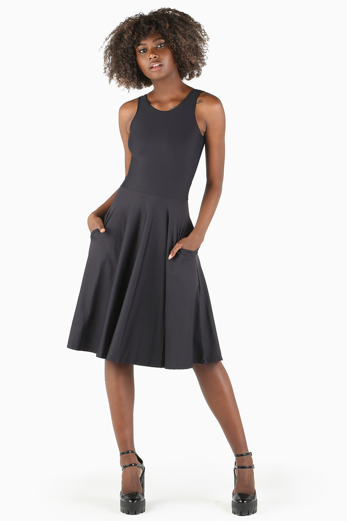 Black princess midi dress with fitted bodice and flowing skirt, designed for comfortable all-day wear across office outfits, events and day-to-night styling.