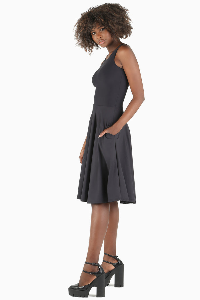 Women's black princess midi dress with flattering silhouette, ideal for corporate wear, weddings, parties and elevated everyday fashion.