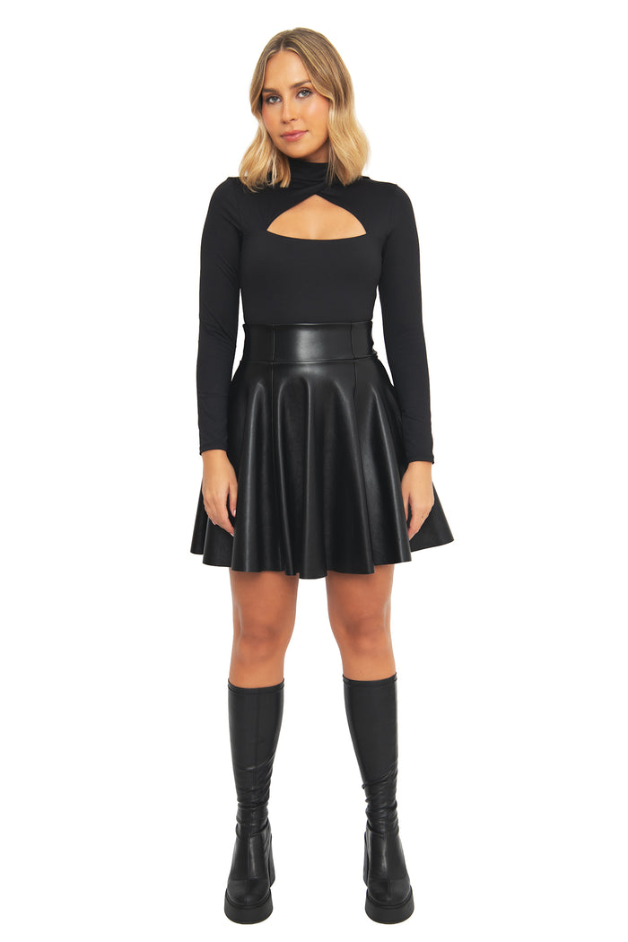 Front view of the BlackMilk Matte Black Triangulation Long Sleeve Top from the Lord of the Rings collection, featuring a mock neck and asymmetric keyhole cutout, styled with a black faux-leather skater skirt for a gothic streetwear look.