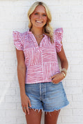Woman wearing a red and white striped shirt with ruffle sleeve accents.