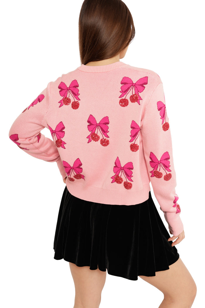 cute festive cardigan with pink bows and berries holiday style