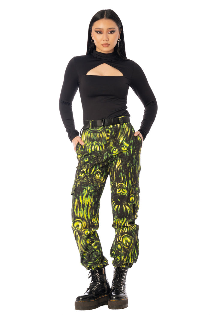 BlackMilk Mesmereyes Cargo Pants – green hypnotic eyeball print cotton cargo Halloween pants with vegan leather trims, part of the BlackMilk Clothing Halloween collection