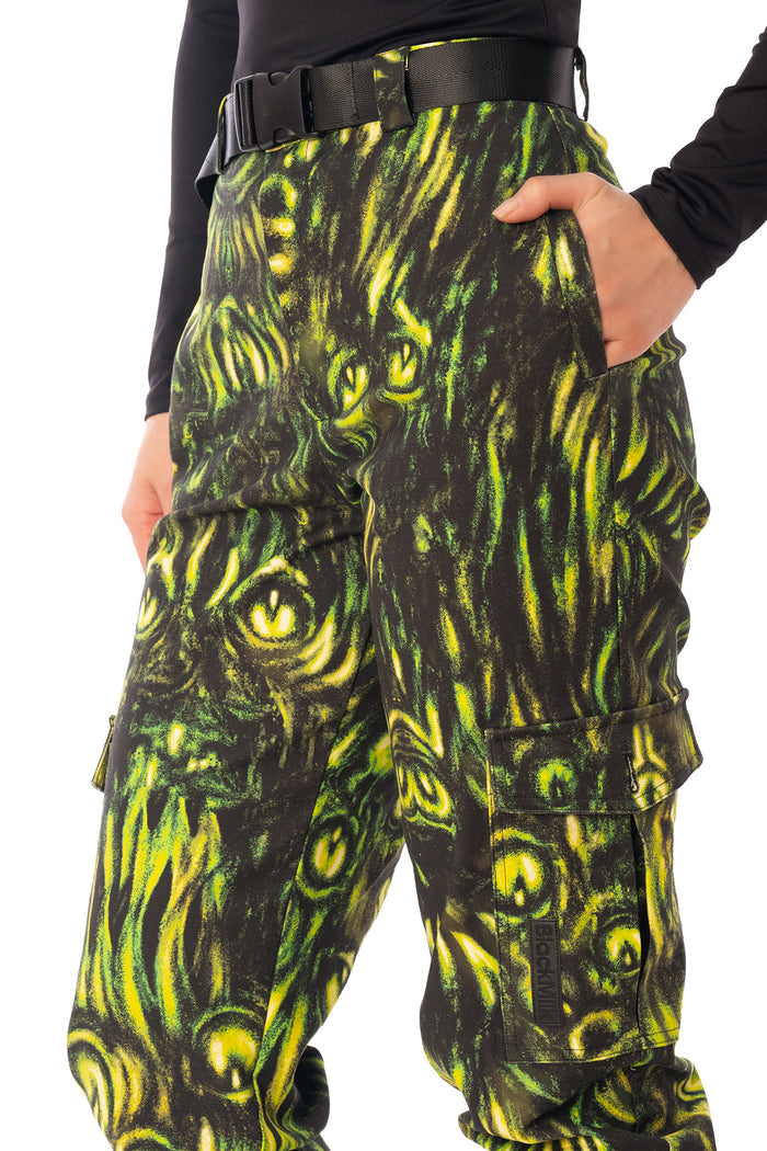 BlackMilk Mesmereyes Cargo Pants – green hypnotic eyeball print cotton cargo Halloween pants with vegan leather trims, part of the BlackMilk Clothing Halloween collection