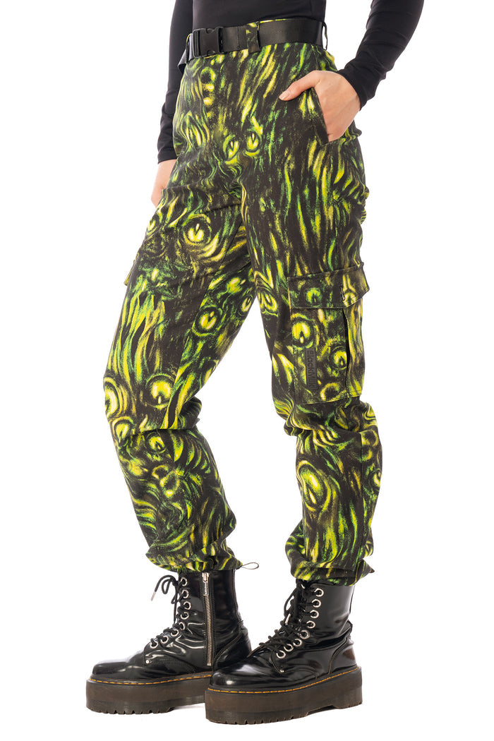 BlackMilk Mesmereyes Cargo Pants – green hypnotic eyeball print cotton cargo Halloween pants with vegan leather trims, part of the BlackMilk Clothing Halloween collection