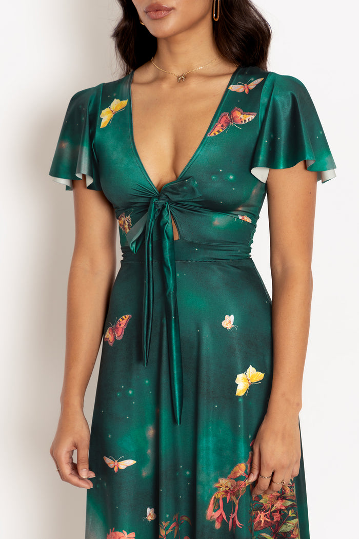 Women's fairy print maxi dress inspired by a midsummer night, combining magical artwork and comfortable stretch fabric for occasion wear and elevated everyday fashion.