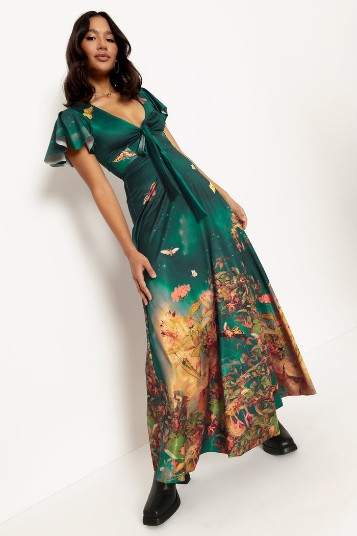 Fantasy-inspired maxi dress with fairy artwork and flattering fit, ideal for weddings, brunch dates, resort wear and statement day-to-night styling.