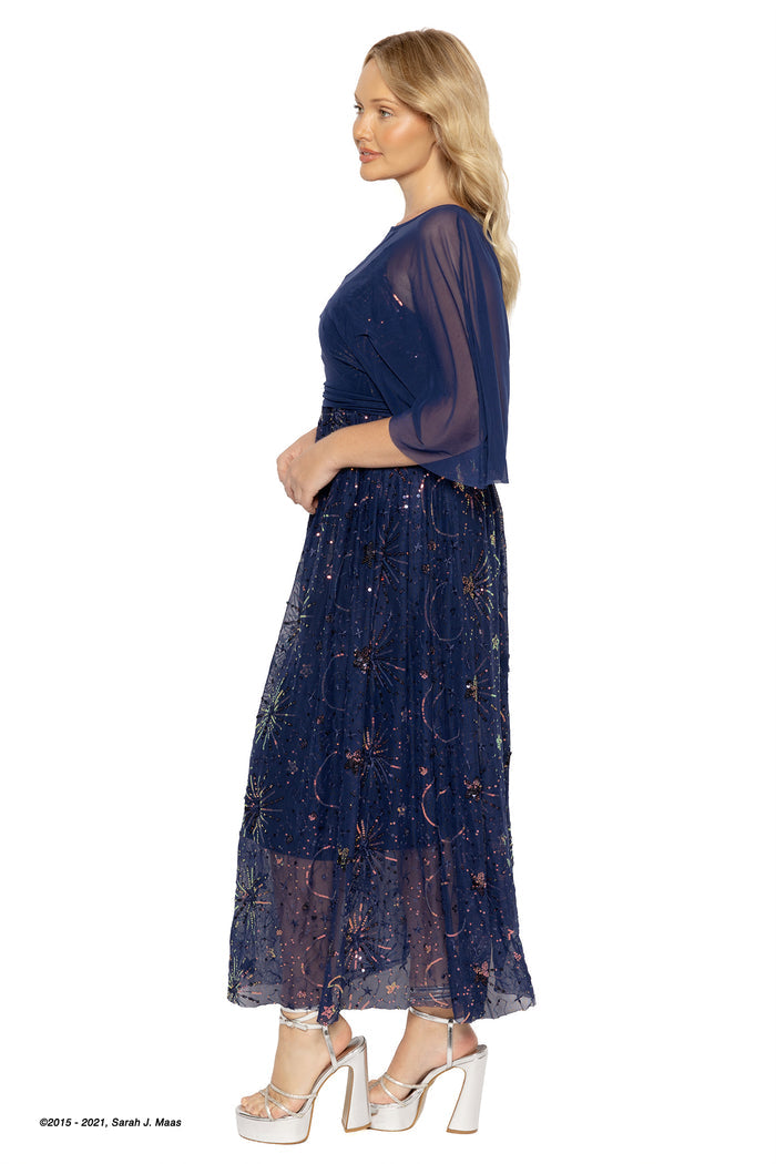 ACOTAR series navy star sequin maxi dress, inspired by A Court of Thorns and Roses books by Sarah J Maas, featuring sheer overlay, shimmering starburst sequins, cape layer and tiered flowing skirt, fantasy formal look