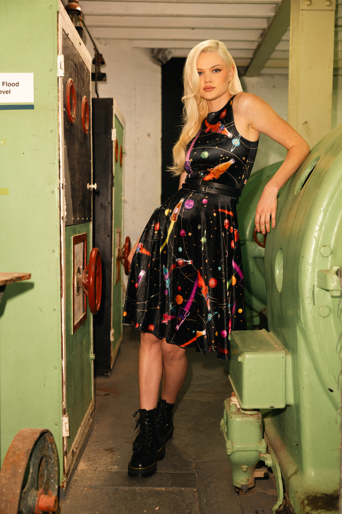 Model wearing Fallout x BlackMilk Nuka-Space Velvet Midi Dress featuring Nuka-Cola rocket ship print on soft black velvet.