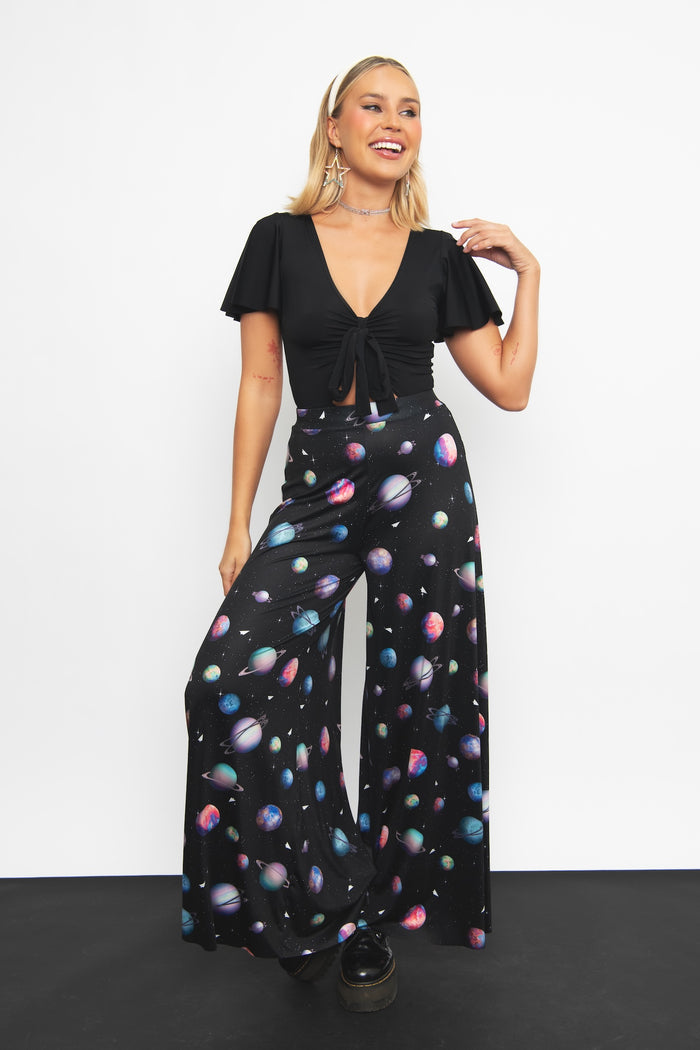 Paper Universe Palazzo Pants featuring an artistic paper-inspired print and flowing wide-leg silhouette, perfect for workwear, travel, casual elegance and everyday comfort.