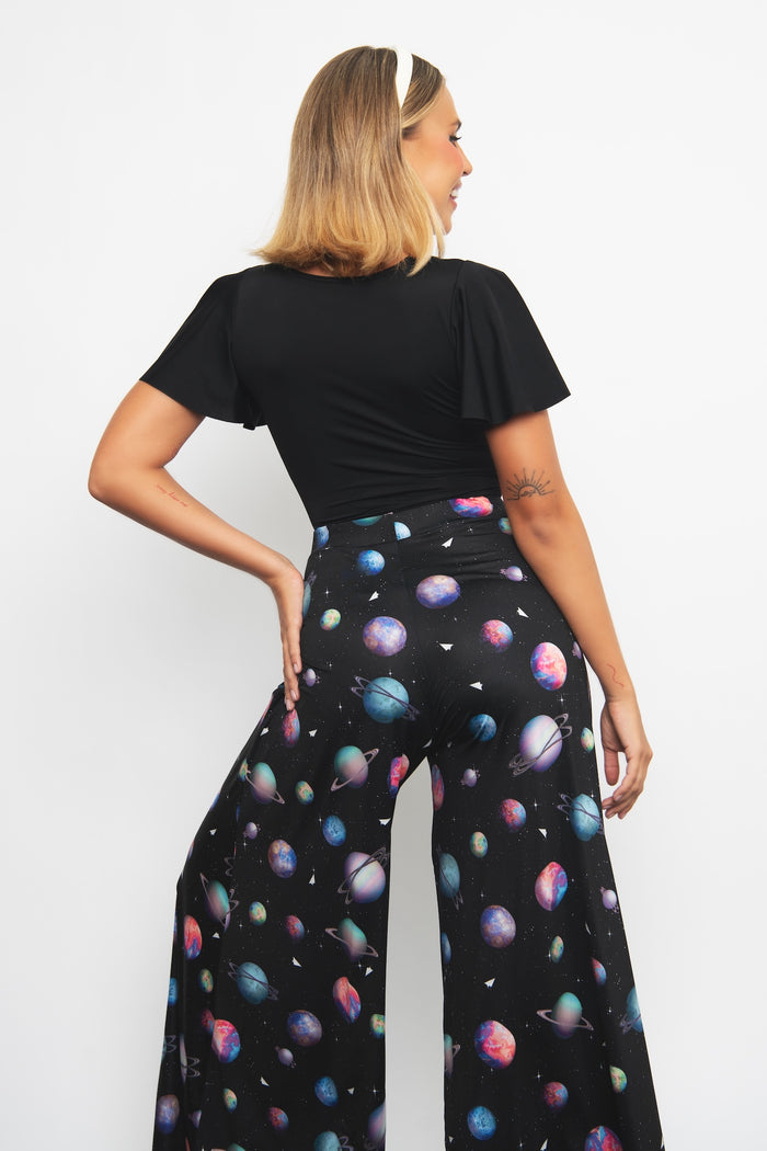 Wide leg palazzo pants with Paper Universe artwork, designed for effortless movement and versatile styling across office outfits, holidays and everyday fashion.