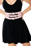 Model wearing pastel pink triple offset vegan leather belt - BlackMilk Lora Zombie wearable art fashion