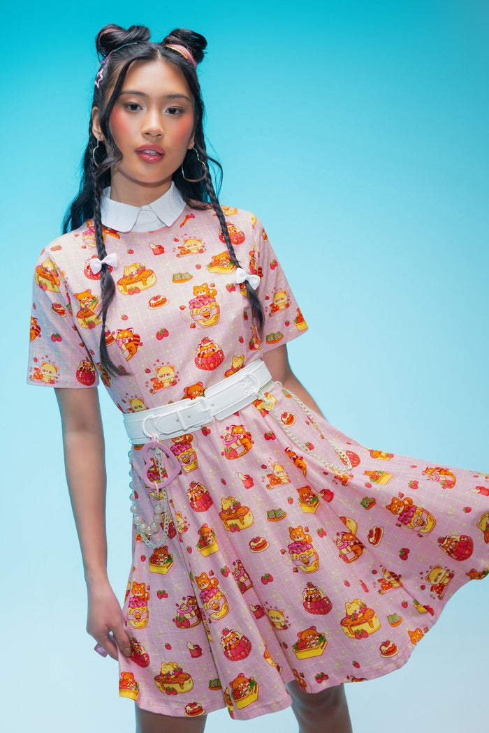 Pastel mini tee dress featuring adorable raccoons, red pandas, shibas, strawberries, cakes and pastries in a playful all-over café-inspired print with a flattering skater silhouette.
