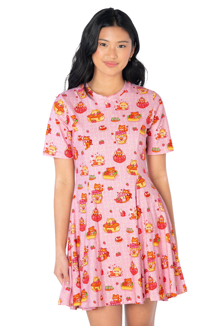 Cute animal print mini tee dress showcasing raccoons, shiba dogs, red pandas and sweet desserts on a pastel background with a fitted bodice and skater skirt.