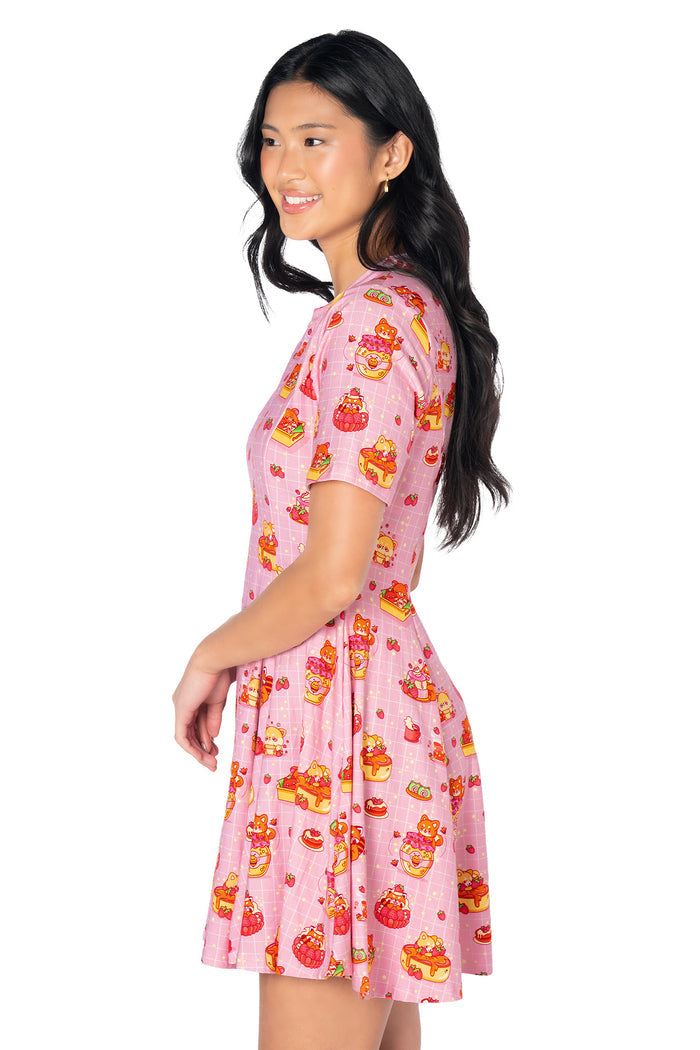 Kawaii-inspired mini tee dress with an all-over dessert and animal print featuring shibas, raccoons, red pandas, cakes and strawberries in a colourful pastel design.