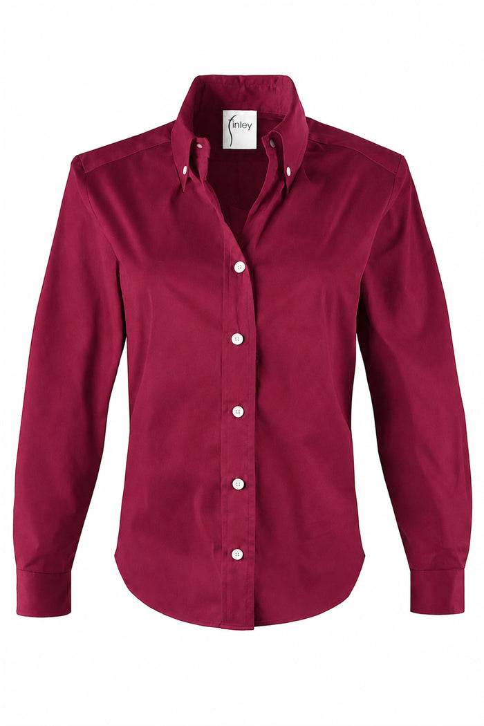 A women's long-sleeve button-down shirt in a deep burgundy red, featuring a classic collar, white buttons, set against a plain white background.