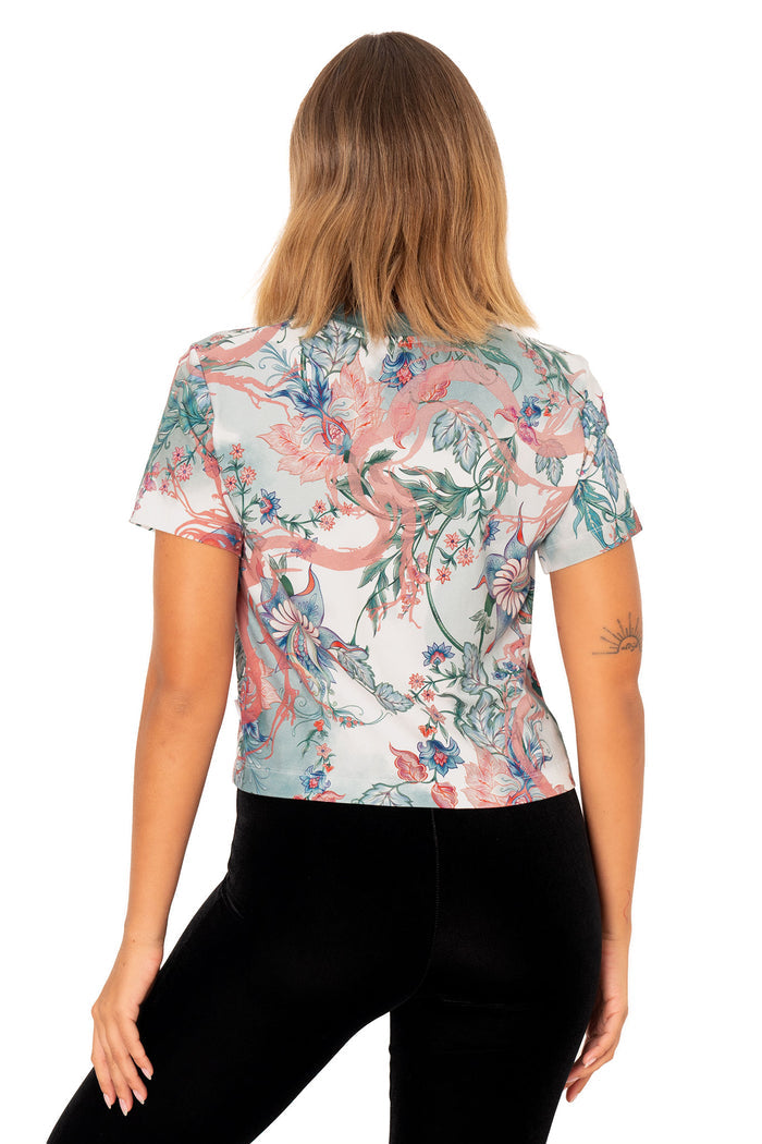 Cropped baby tee with short sleeves, white tiger print and soft floral artwork in pastel tones for statement everyday wear
