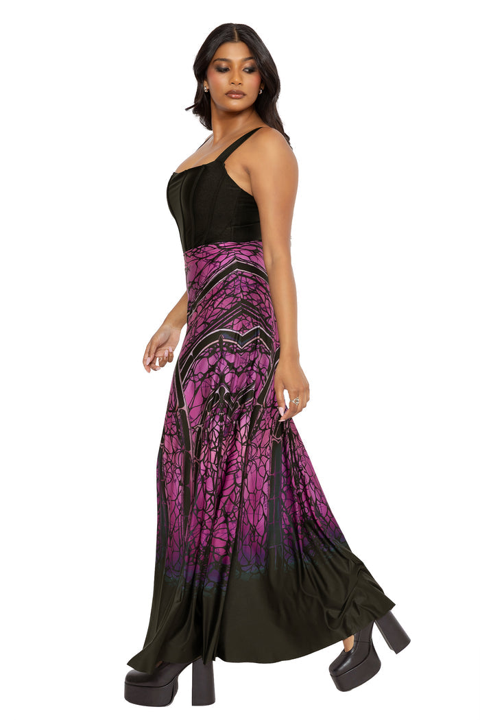Whimsigoth maxi skirt with spider web inspired cathedral artwork and flowing gothic movement in rich purple and black tones. This dark fairycore skirt blends alternative goth and fantasy witch aesthetics with an elegant floaty silhouette.