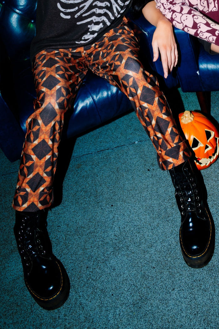 BlackMilk Pumpkin Patchwork Cuffed Pants – orange pumpkin and slasher print cuffed Halloween pants, part of the BlackMilk Clothing Halloween collection
