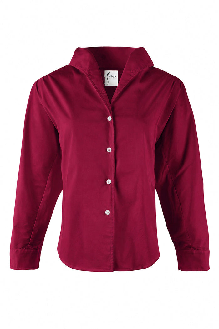 A women's long-sleeve button-up shirt in a deep burgundy red, featuring a pointed collar and white buttons, shown against a plain white background.