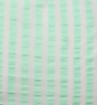 Textured fabric with a subtle pattern on a light green background