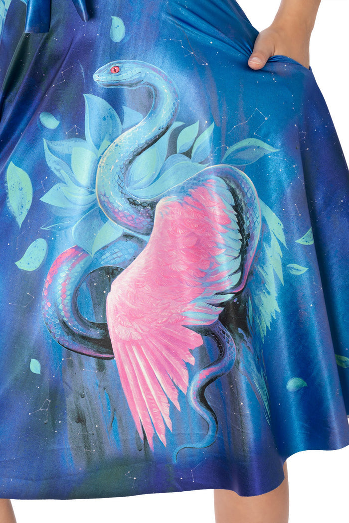 Side view of blue Lora Zombie serpent print midi dress - BlackMilk wearable art Rio dress with pockets
