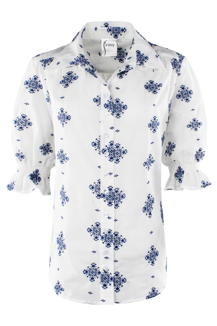 White blouse with blue floral pattern on a white background