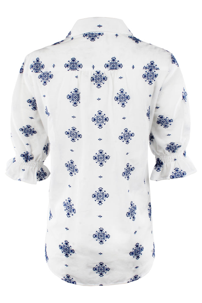 White shirt with blue floral pattern on a white background
