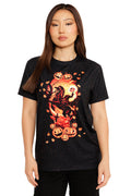 Woman wearing a black t-shirt with Halloween-themed design featuring pumpkins and a ghost.