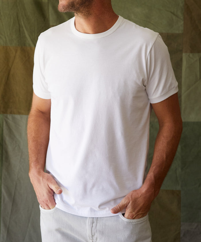 Man wearing bright plain white t-shirt