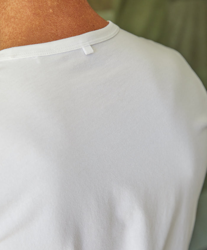 Man wearing bright plain white t-shirt