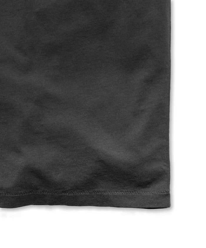Closeup of seem of black crew neck t-shirt