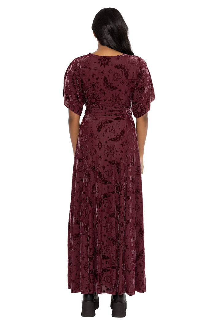 Whimsigoth burned velvet maxi dress with celestial sigils, mystical witch symbols and flowing kimono sleeves in deep berry tones. This gothic dress combines dark fairycore and cottage witch aesthetics with a romantic split skirt and elegant movement.
