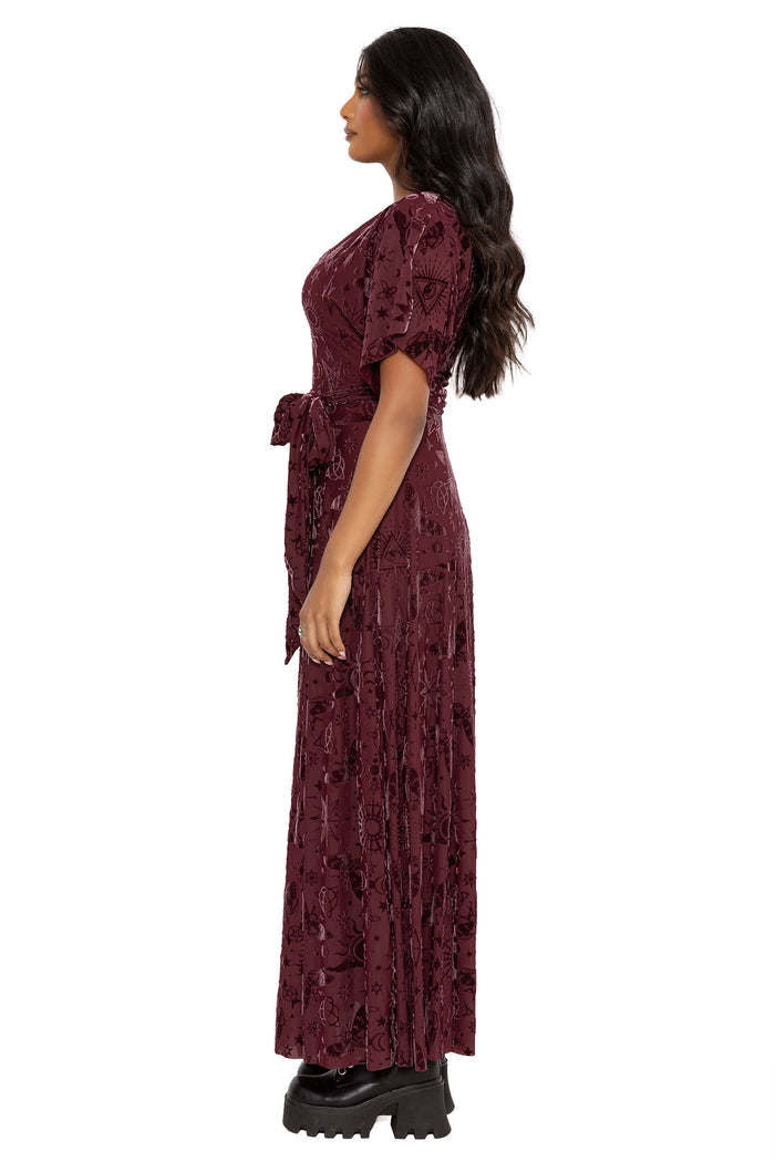 Gothic kimono maxi dress with occult inspired artwork, sheer burned velvet texture and dramatic flowing sleeves. Featuring a fitted bodice, wrap-style belt and thigh-high split, this alternative goth dress blends fantasy witch and dark academia fashion.