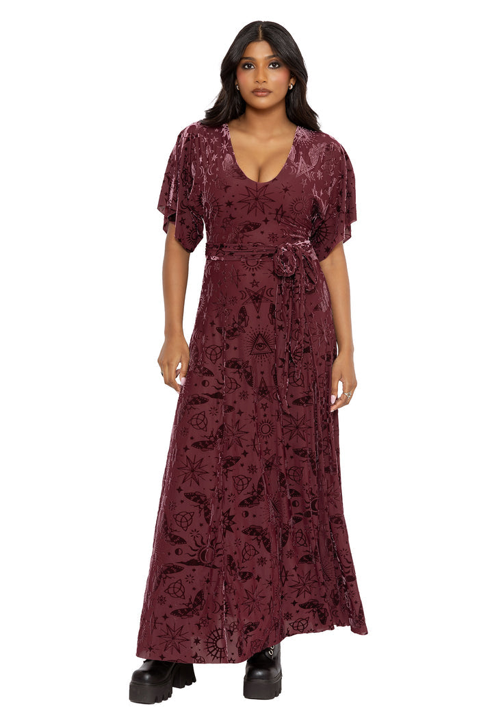 Fantasy witch inspired berry velvet maxi dress with celestial sigils, mystical symbols and flowing kimono sleeves. This dark fairycore dress combines whimsigoth and gothic romantic fashion with elegant movement and dramatic witchcore styling.